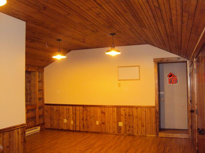 stained pine ceiling and wainscotting, floating laminate floor